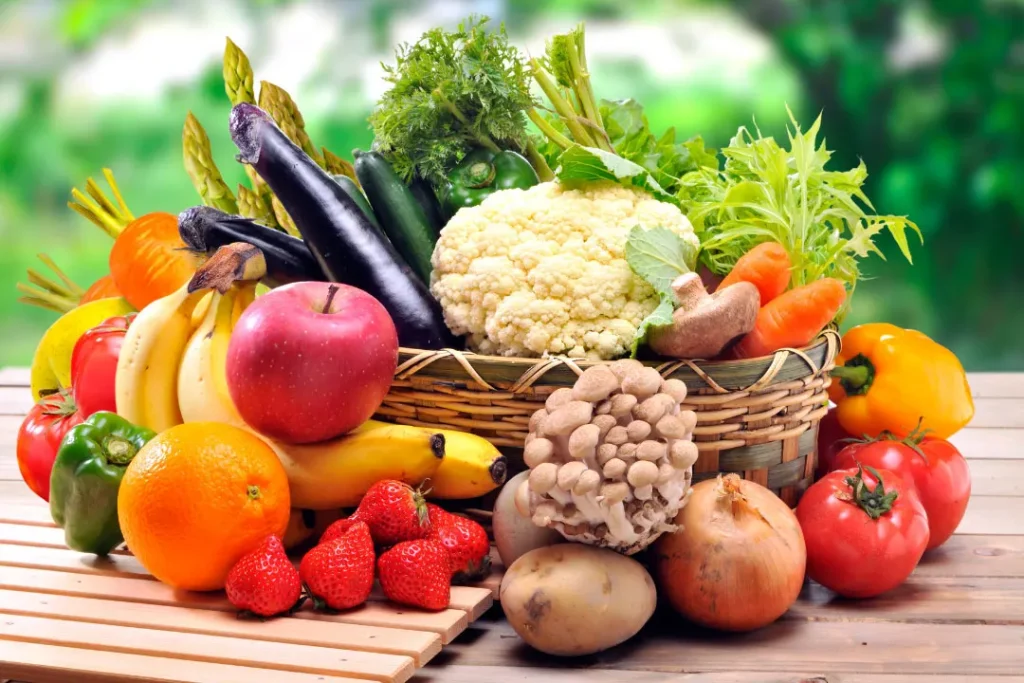 fresh fruits,vegetables and grains on wooden table